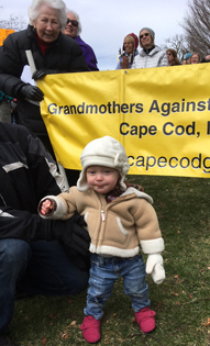 Toddler in front of GAGv banner